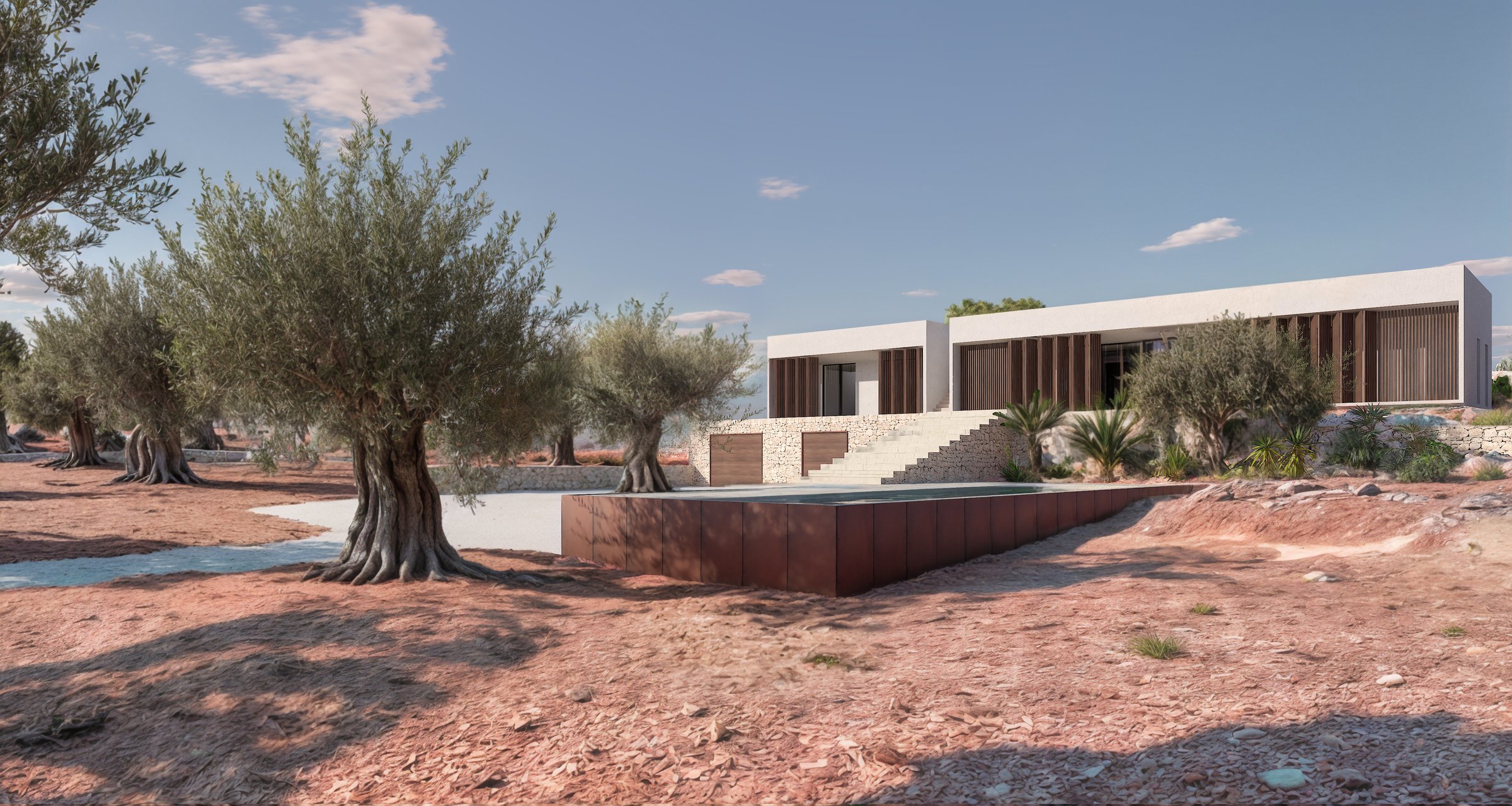 Exterior view of a bioclimatic house amongst olive trees in Carovigno